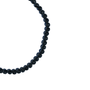 Necklace with black beads on a white background