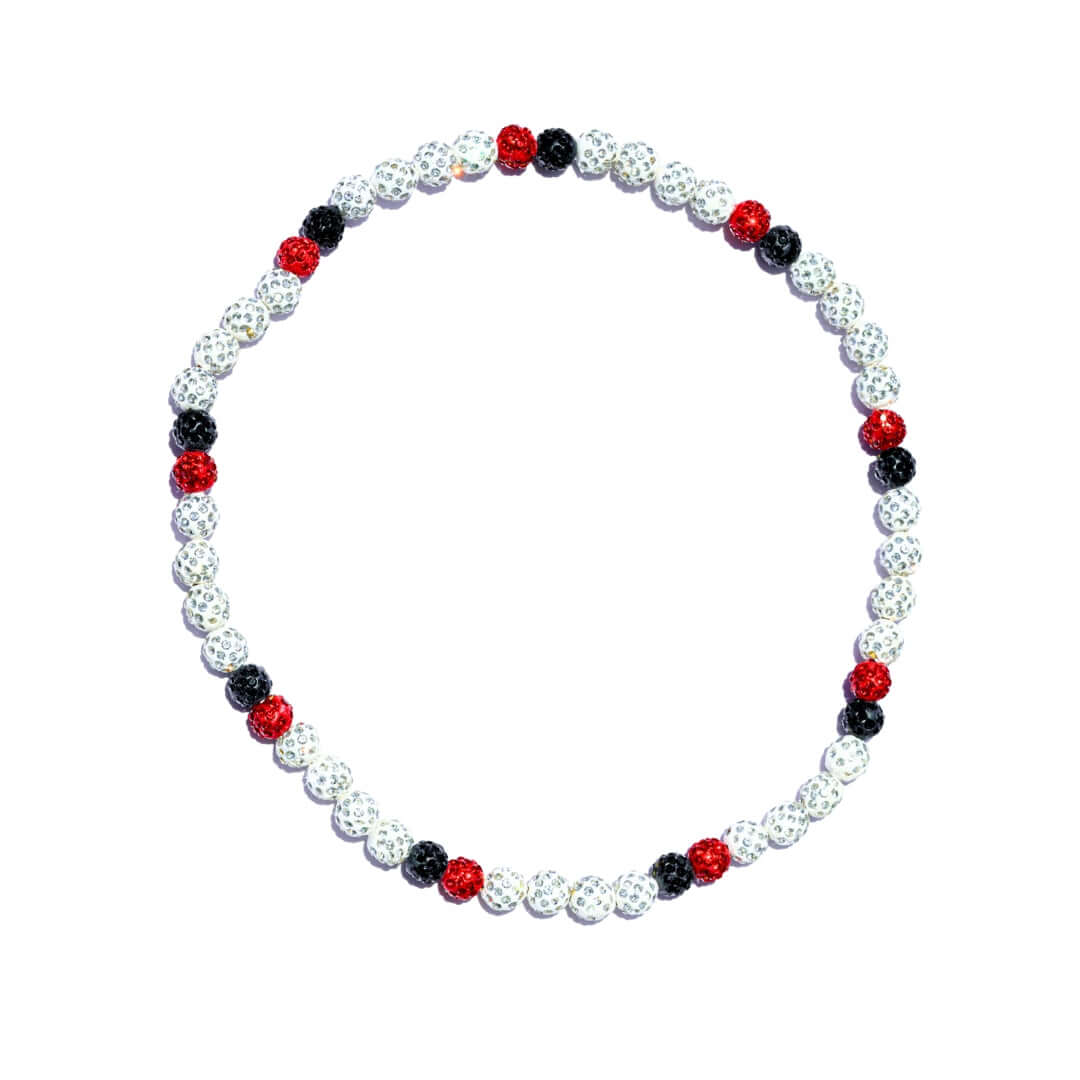 Necklace with red, black, and white beads on a white background