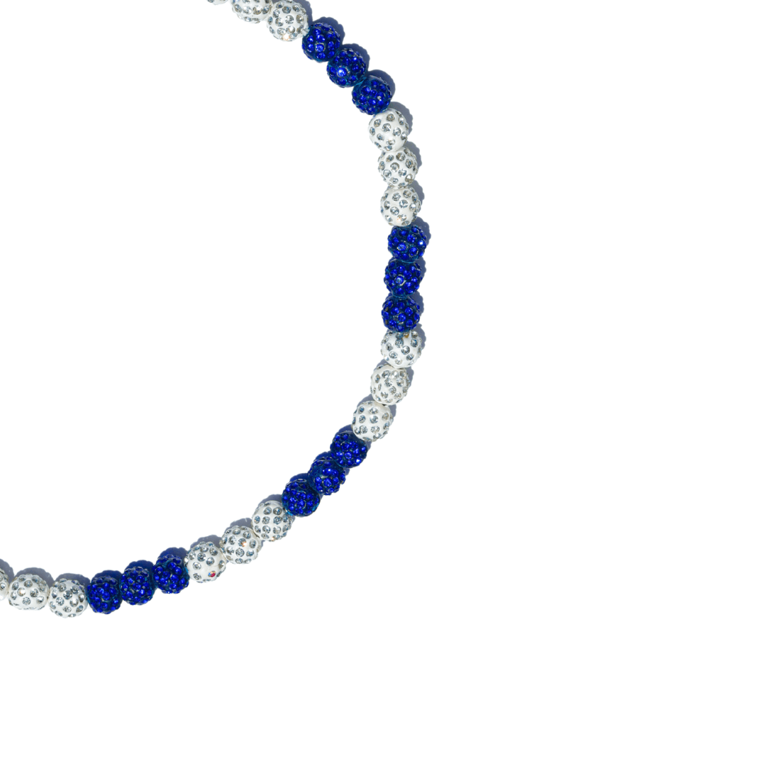 Necklace with blue and white beads on a white background
