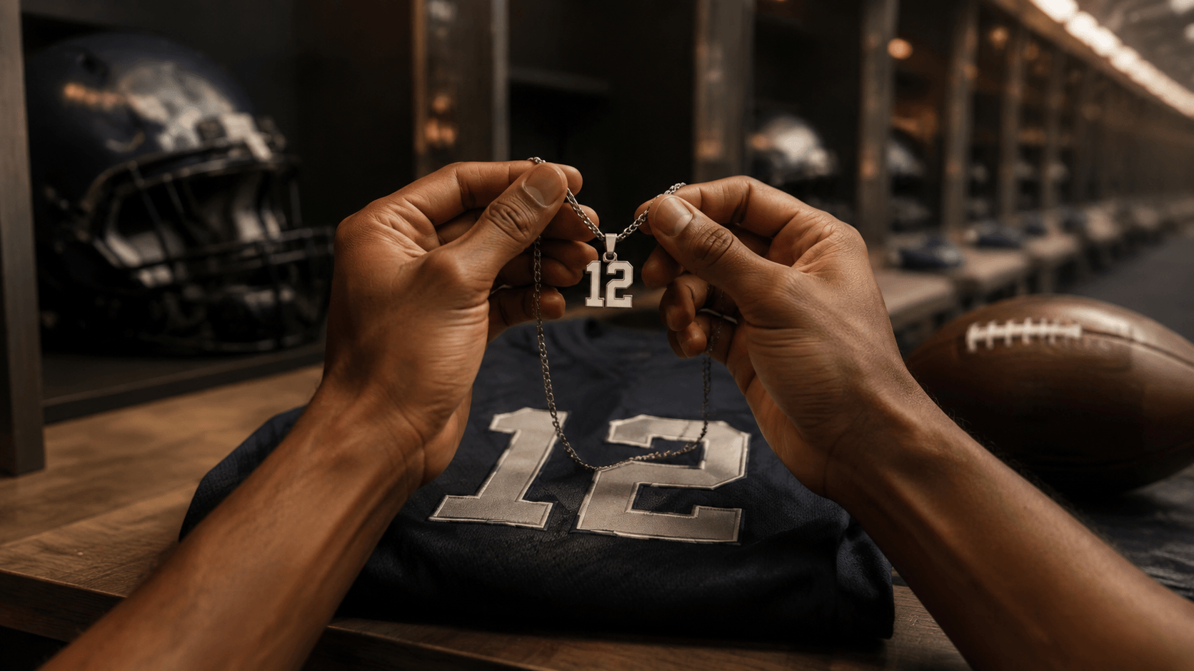 Football player holding a number 12 necklace above a matching jersey