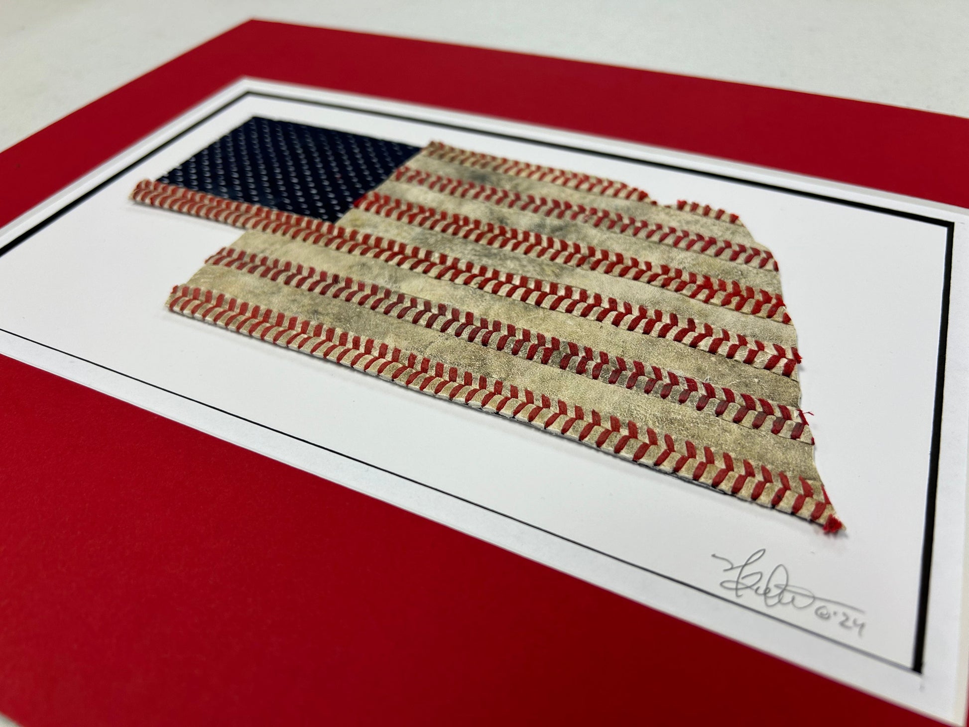 Nebraska Baseball Artwork - Made from Reclaimed Baseballs featuring a U.S. flag design.