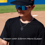 Person wearing a black cap and sunglasses on a baseball field wearing the all in faith home plate baseball necklace