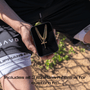 Person holding a black box with 3 gold chains and all in faith original baseball cross necklace