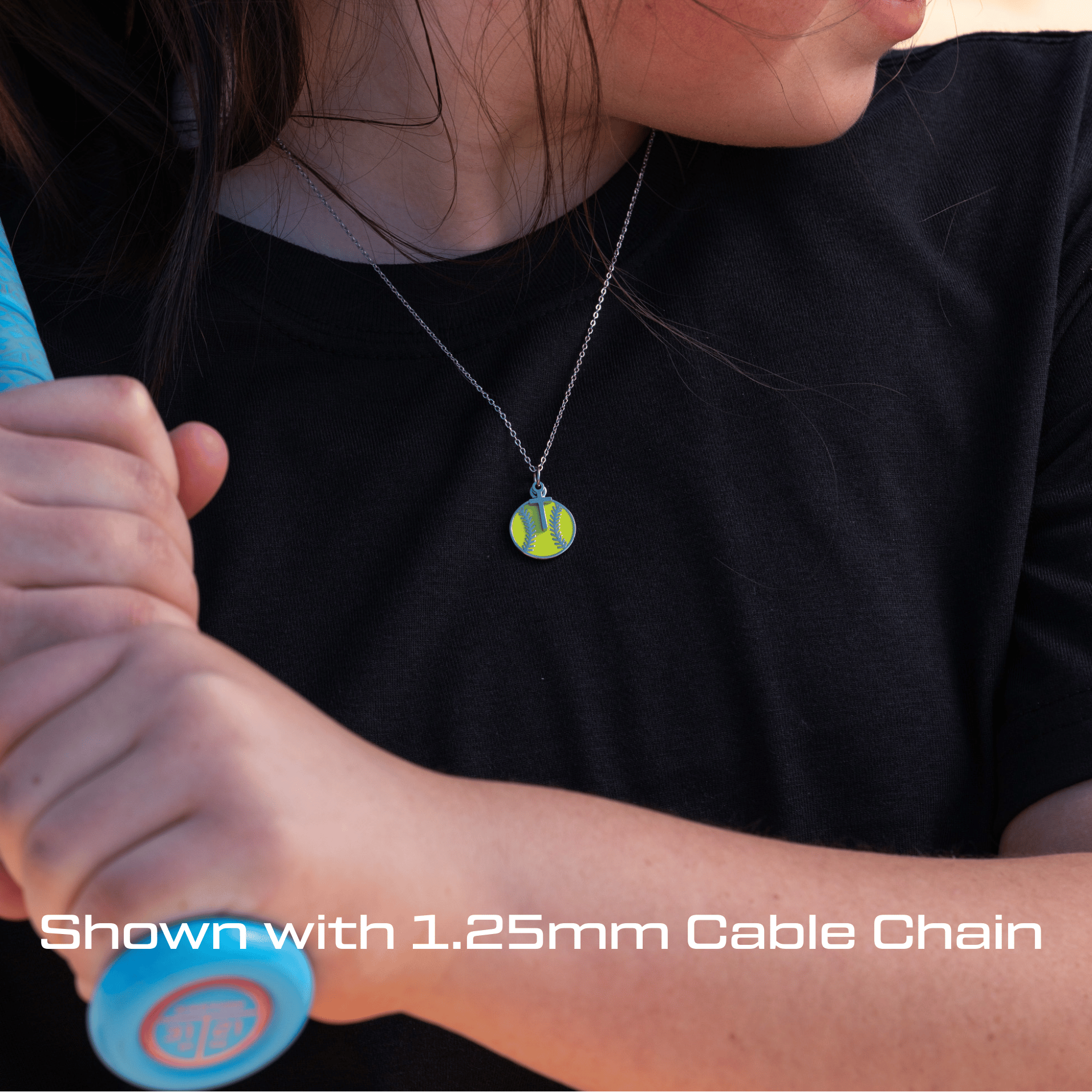Person wearing an All in Faith Softball Dangle Cross necklace 
