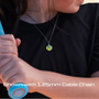 Person wearing an All in Faith Softball Dangle Cross necklace 