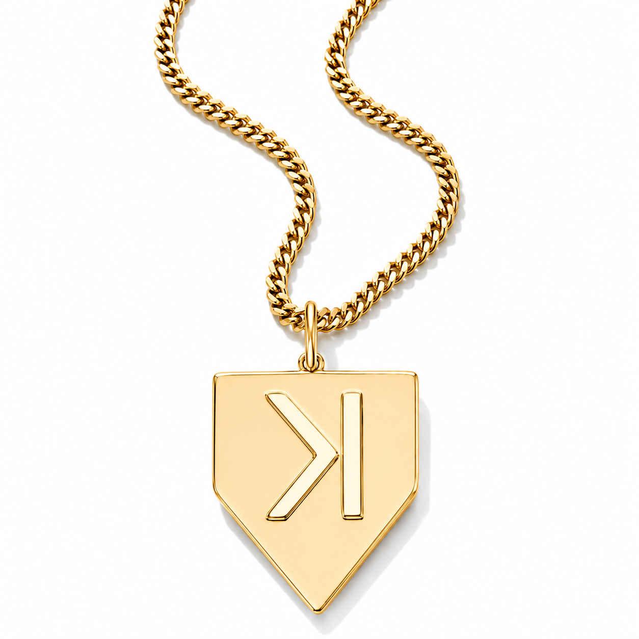 A gold-tone Cuban link chain necklace with a shield-shaped pendant featuring a stylized letter 'K' cutout, shown on a clean white background.