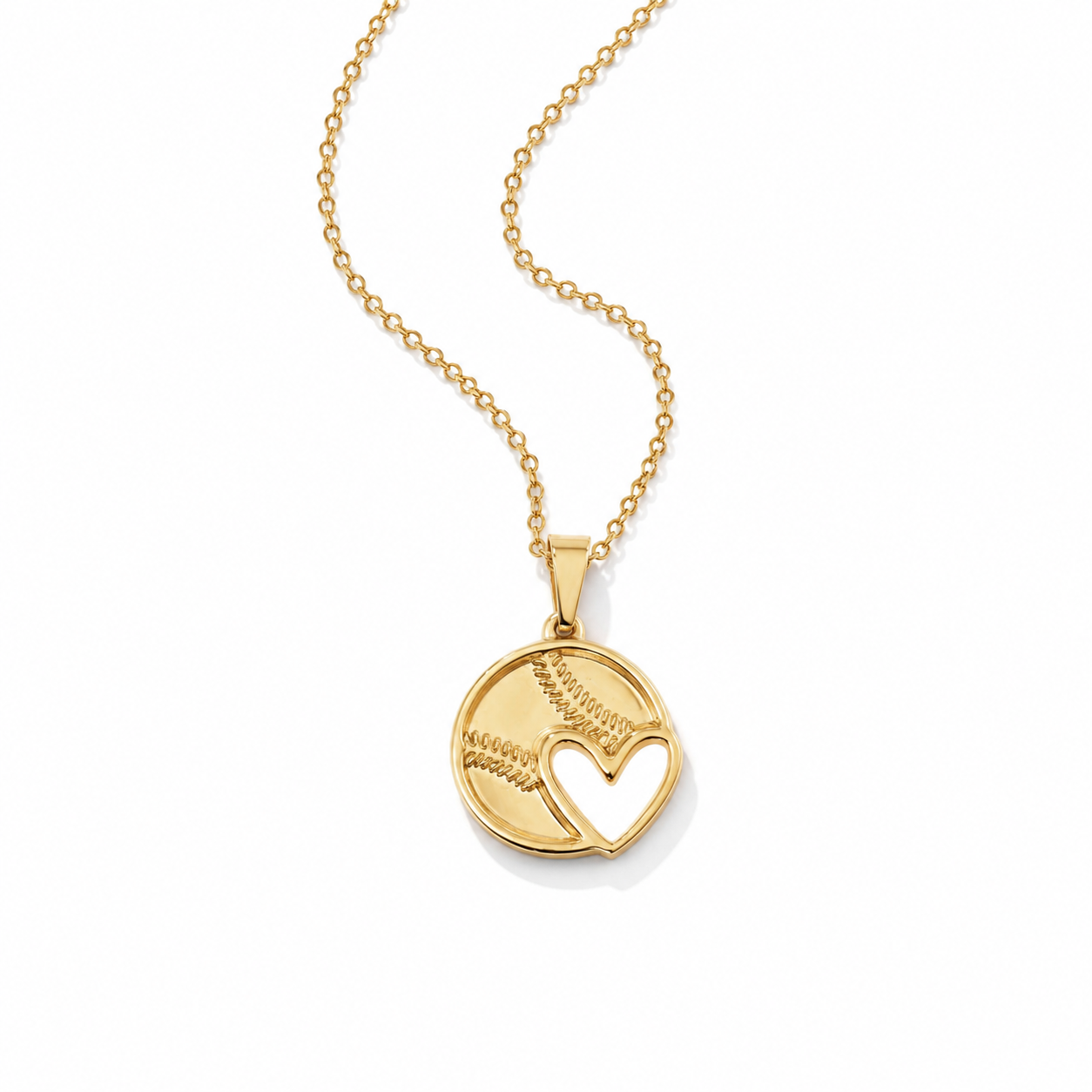 A gold necklace featuring a circular pendant with a baseball design and an open heart cutout, displayed on a clean white background.
