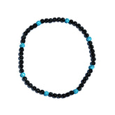 Black and blue beaded necklace on a white background