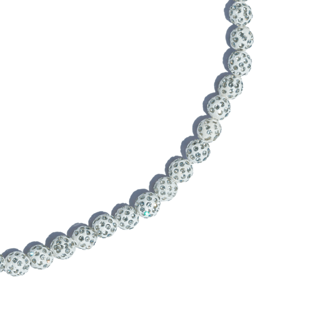 closeup of Necklace with clear beads on a white background