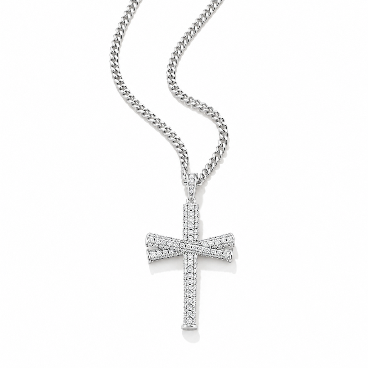 A silver cross pendant necklace paved with small clear stones, hanging from a silver curb chain against a plain white background.
