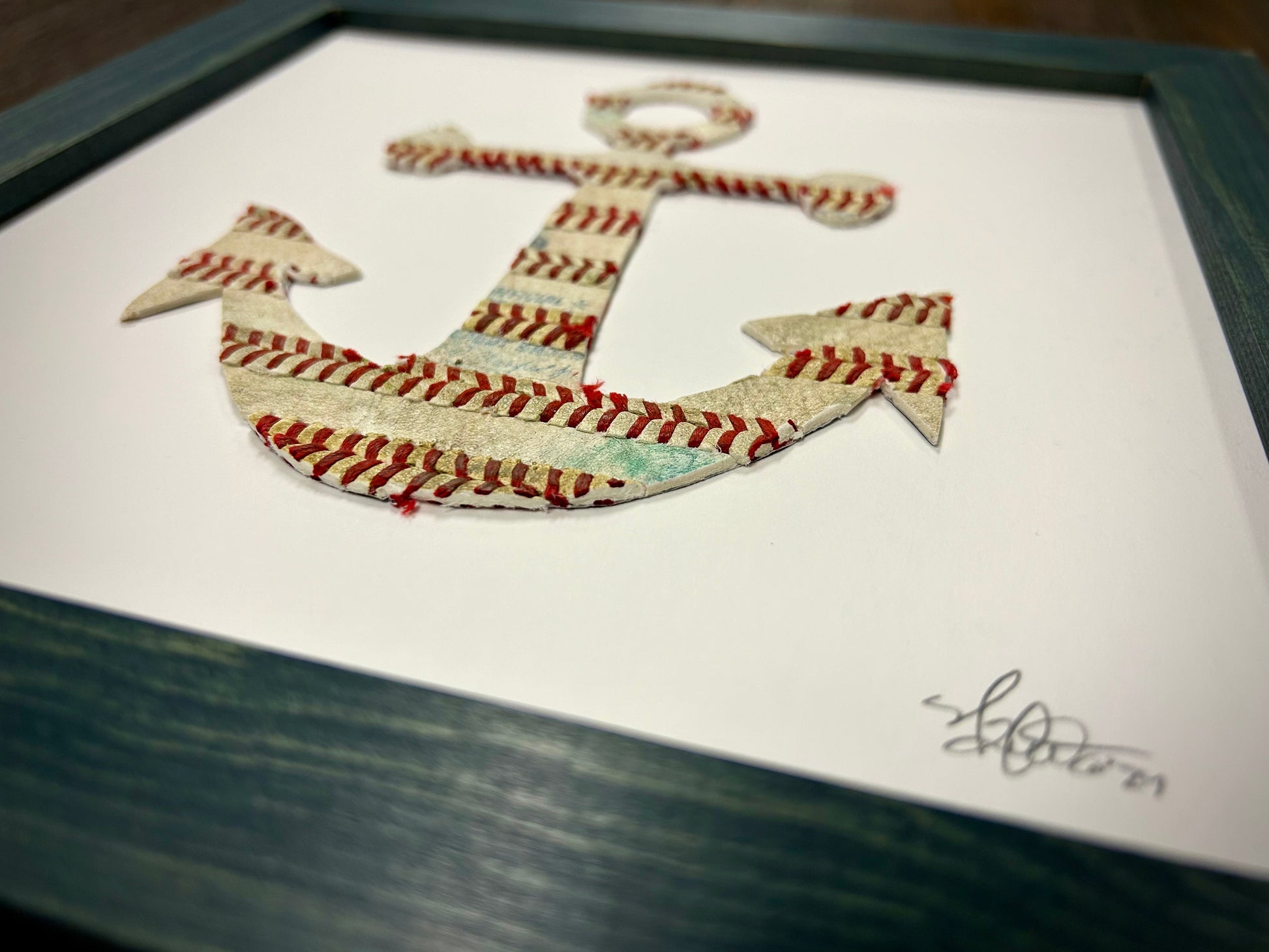The Anchor Original Artwork - Made from Actual Used Baseballs featured in a framed design with baseball stitching.