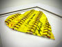 Softball Heart Artwork titled “Seams of Love” featuring a handcrafted heart with yellow leather and red stitching.