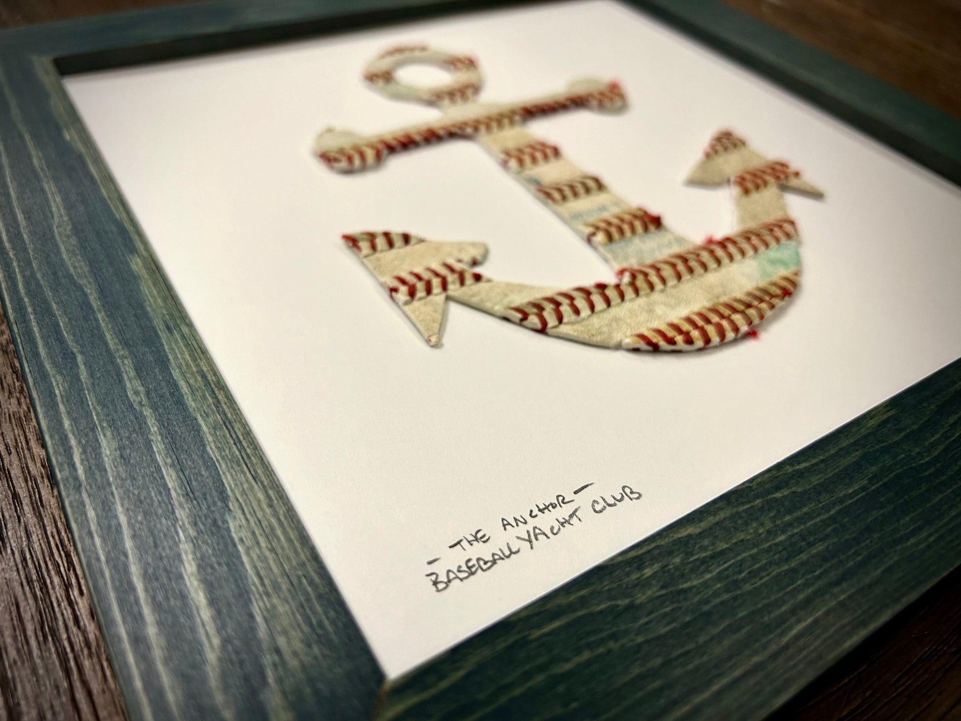 The Anchor Original Artwork - Made from Actual Used Baseballs, featuring a framed anchor design from baseball leather.