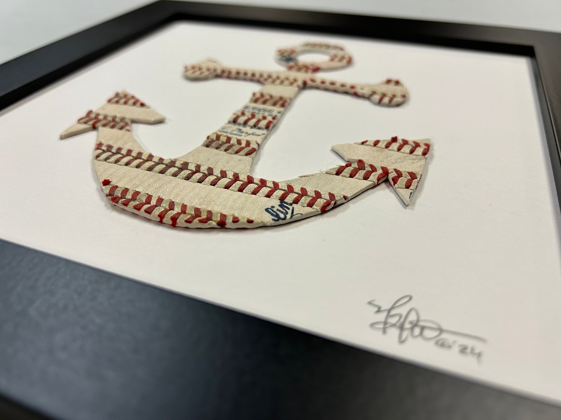 The Anchor Original Artwork - Made from Actual Used Baseballs, featuring a baseball-themed anchor design in a framed display.