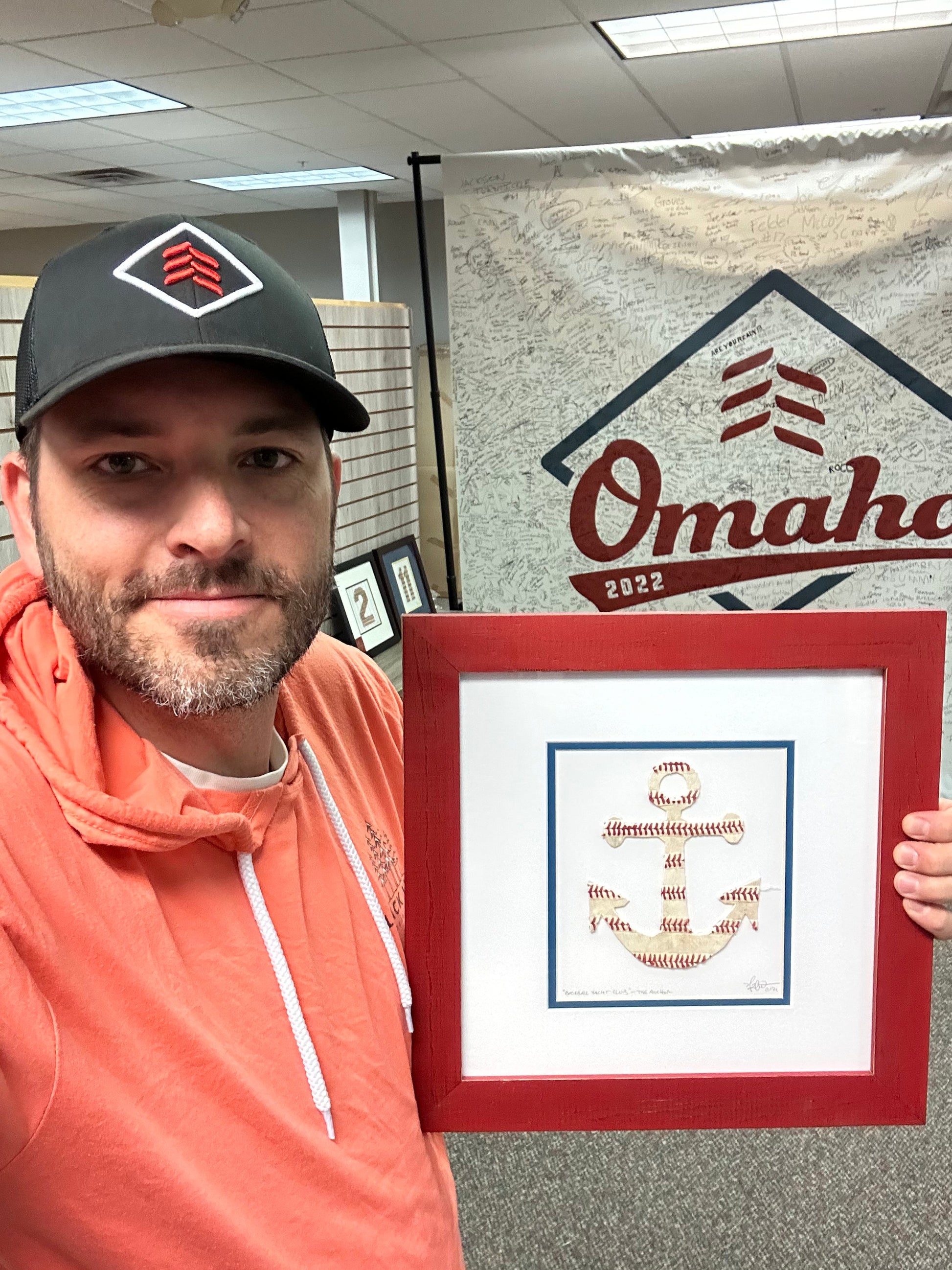 The Anchor Original Artwork - Made from Actual Used Baseballs showcased by an artist in a casual setting.