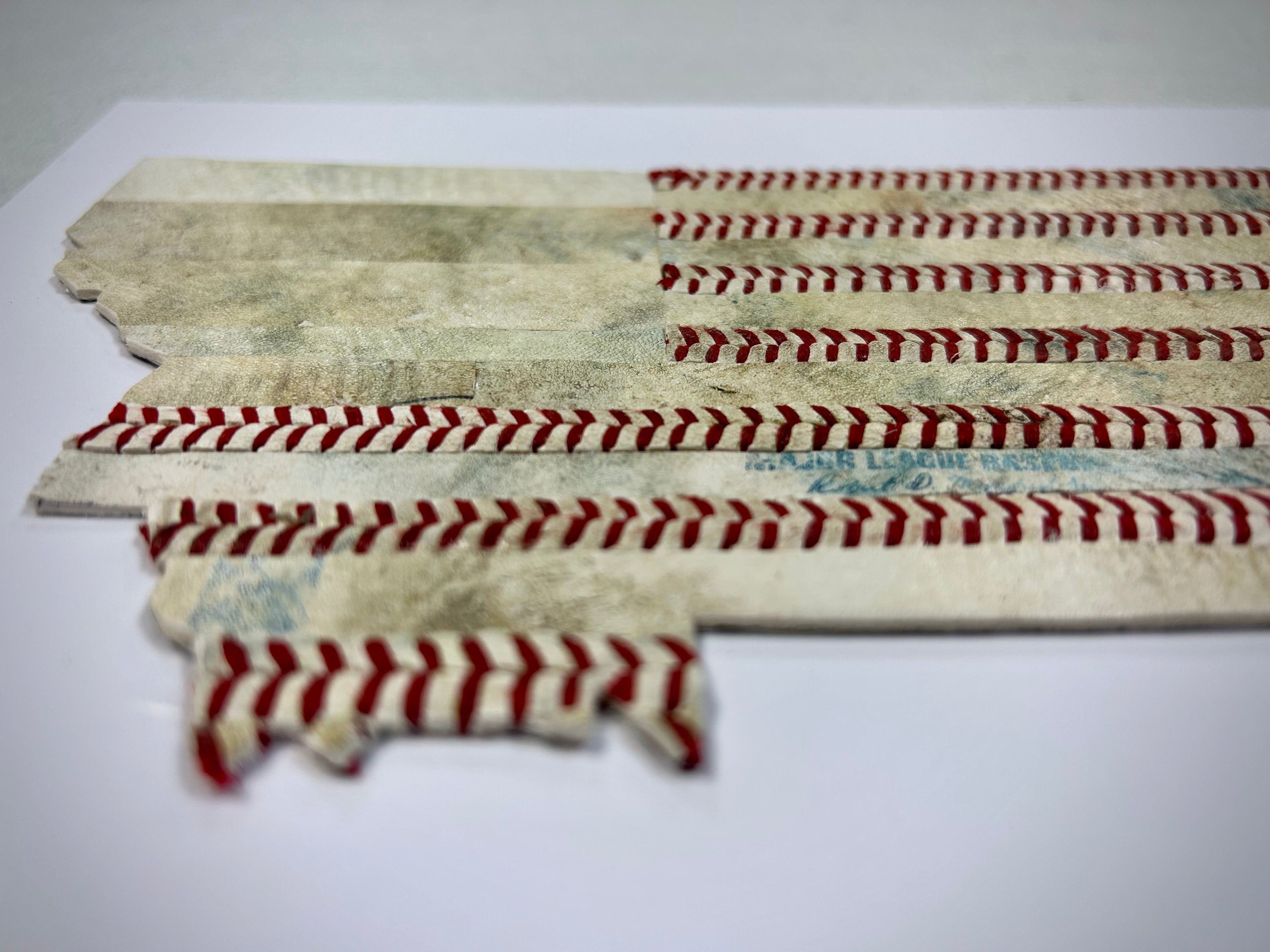 Montana Original Baseball Artwork - made from used baseballs, featuring a design of the state with baseball stitching.
