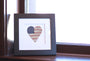 Framed artwork titled "America's Love" Original Artwork featuring a heart design with American flag and baseball patterns.