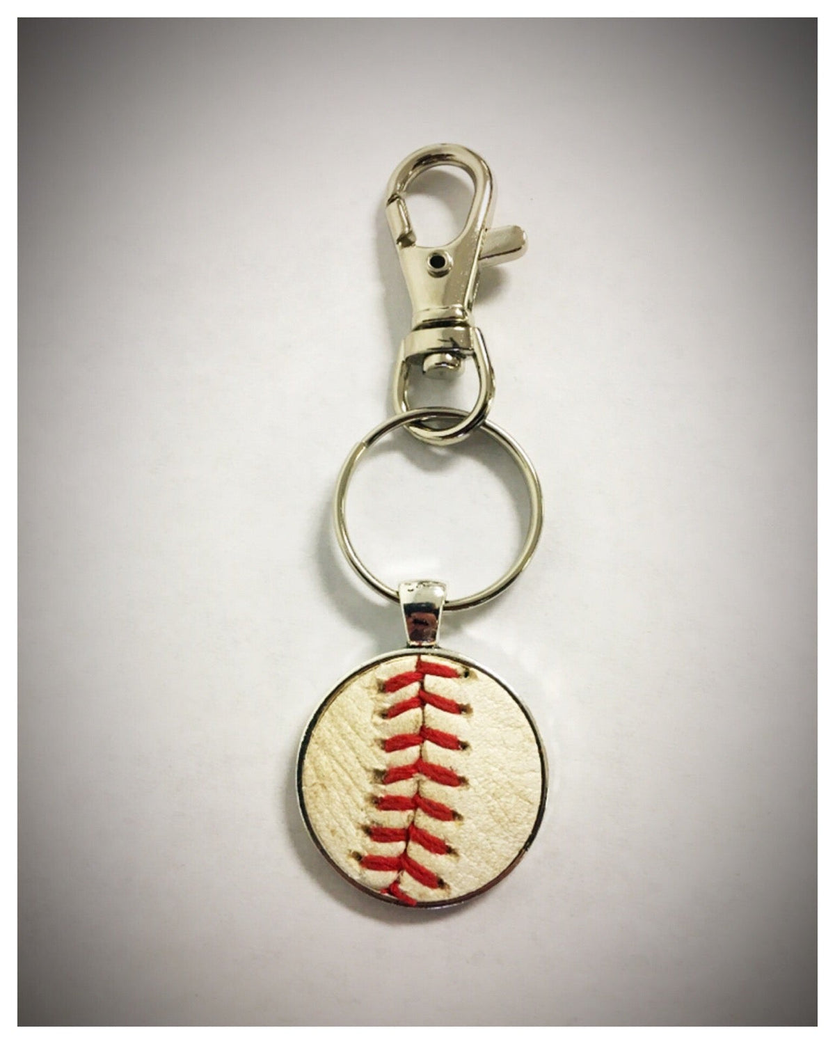 The Baseball Seams Company Baseball Seam Keychain made with used baseball seams, product detail view