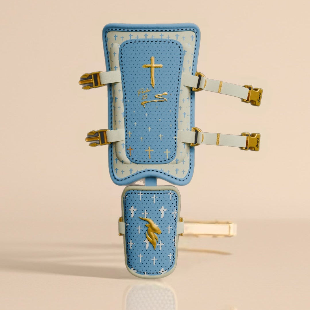 Psalm 23 baseball leg guard in blue and cream with gold cross accents, protective shin guard for hitters with faith-based design and toe guard included
