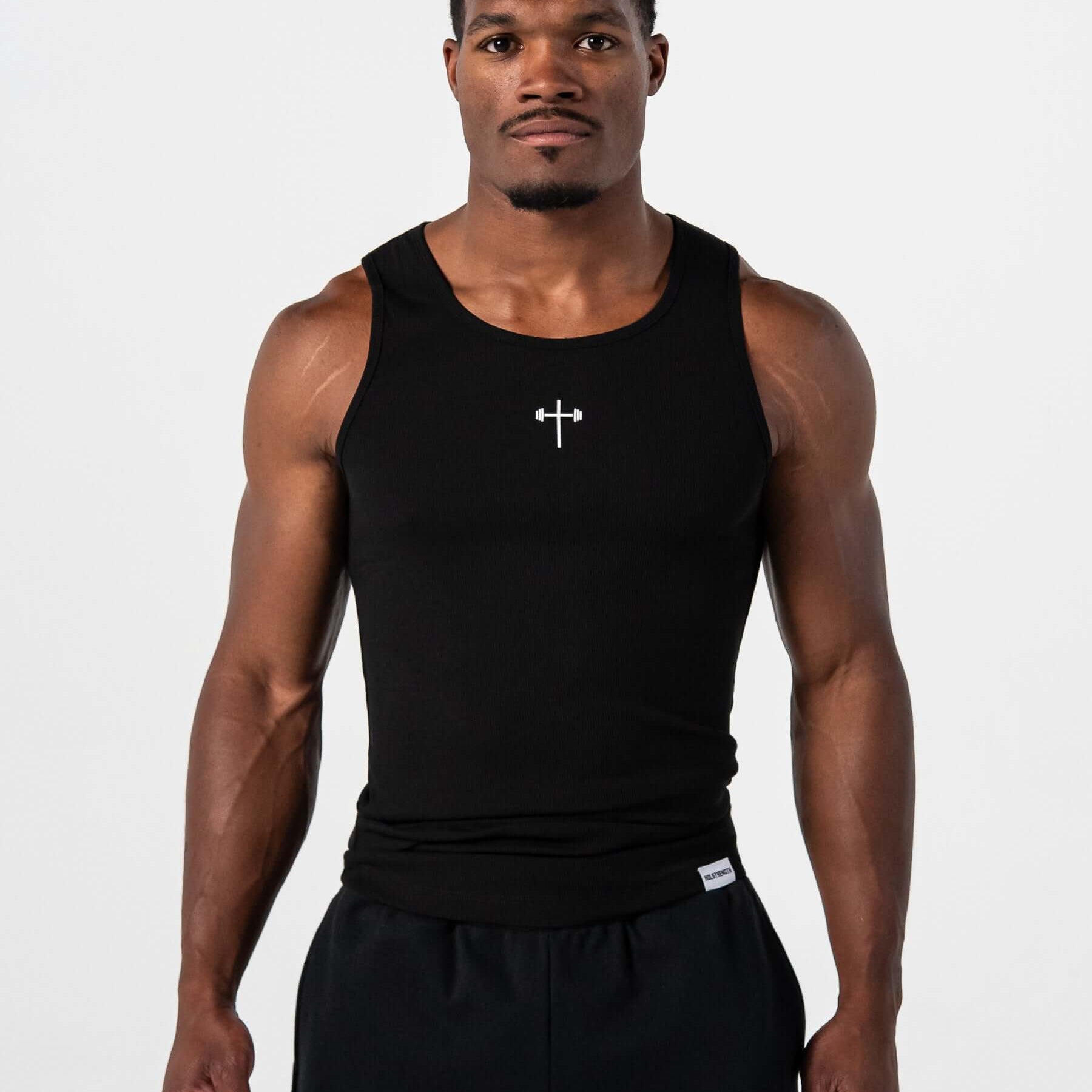 HolStrength male model wearing a black ribbed Christian workout tank, front view