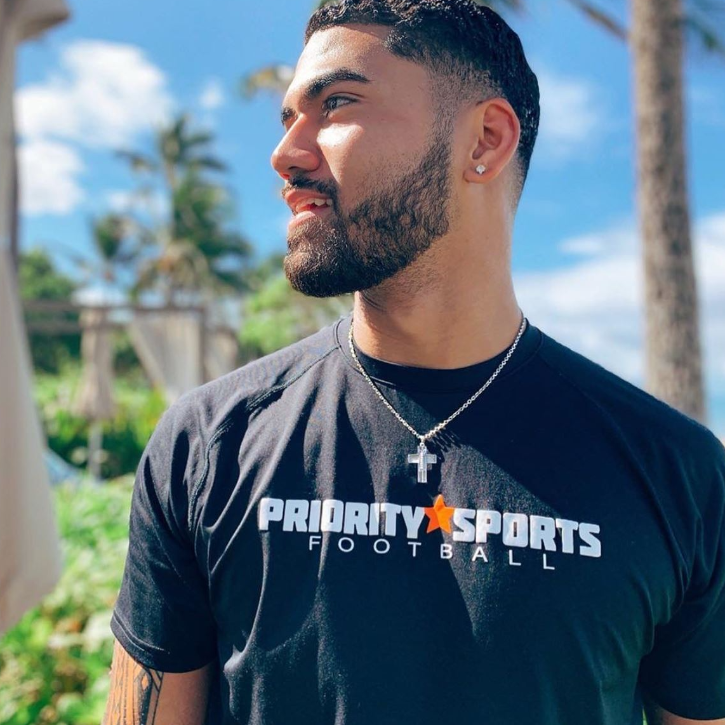 Jordan Ta Amu Wearing All In Faith Football Cross Necklace