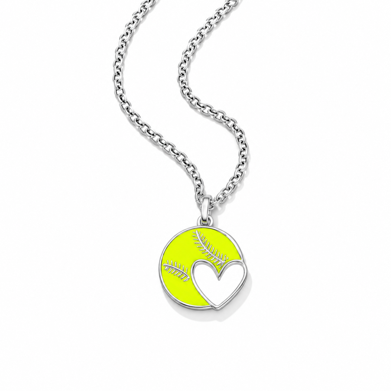 A silver chain necklace with a round pendant featuring a bright yellow softball design and a white heart cutout, shown on a plain white background.