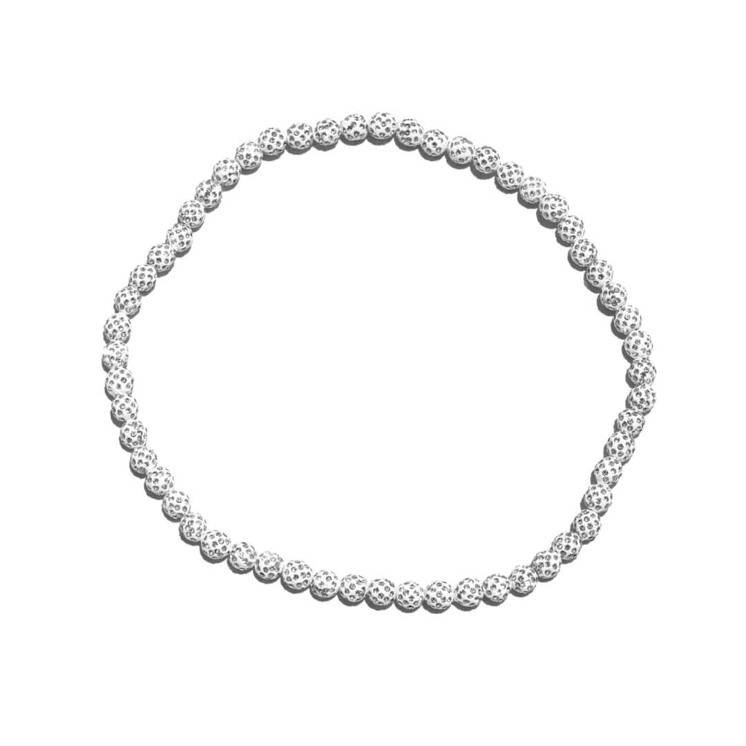 white beaded necklace on a white background