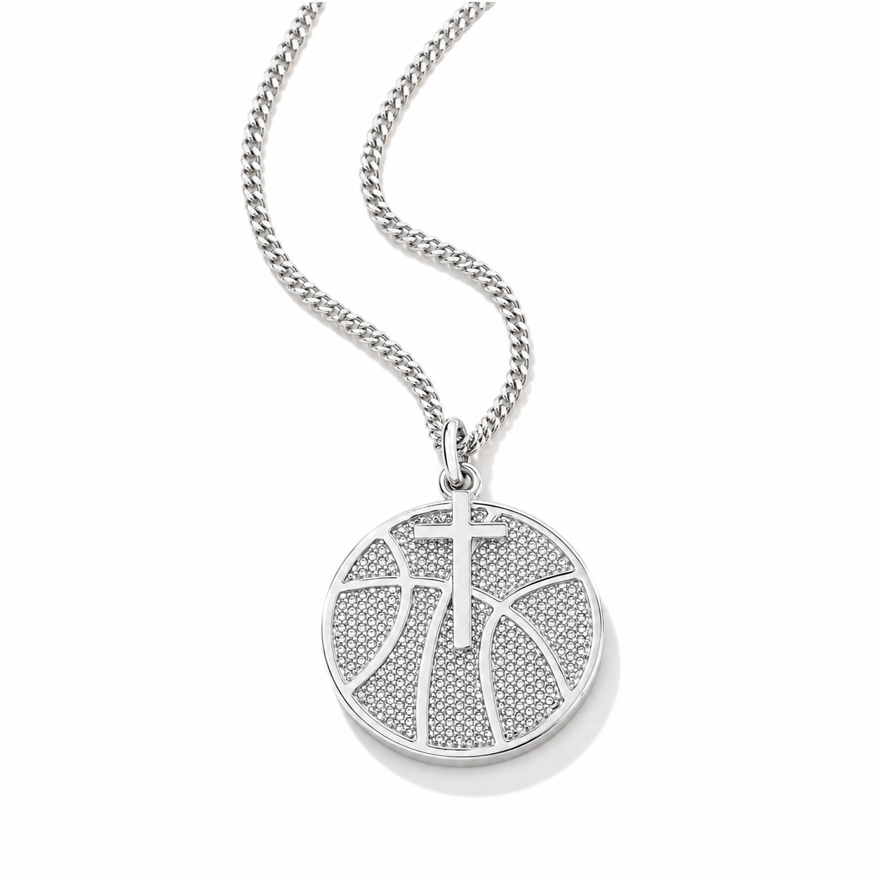 A silver-toned round pendant necklace featuring a basketball design paved with small clear stones, suspended from a matching curb chain on a white background.