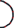 black and red iced out necklace on white background