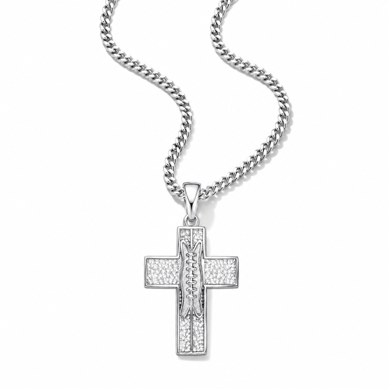 A silver-toned cross pendant necklace featuring a textured, pavé-set design with a central raised figure, suspended from a matching curb chain against a plain white background.