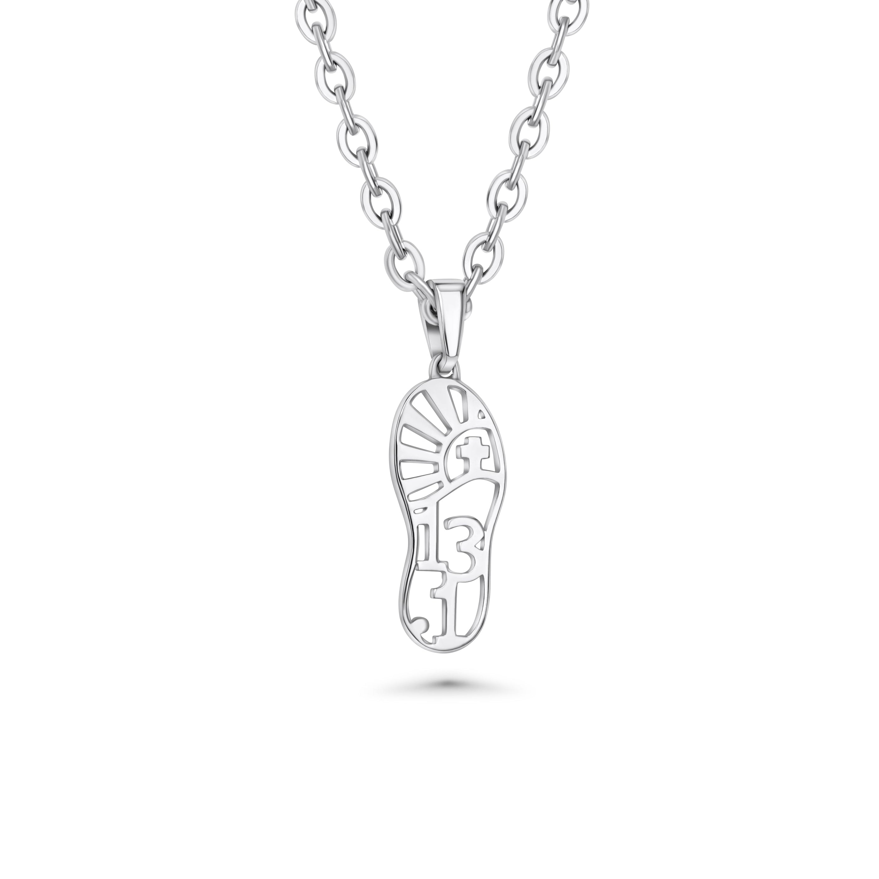 Silver necklace with a shoe-shaped pendant with 13.1 and cross on the inside of the pendant on a white background