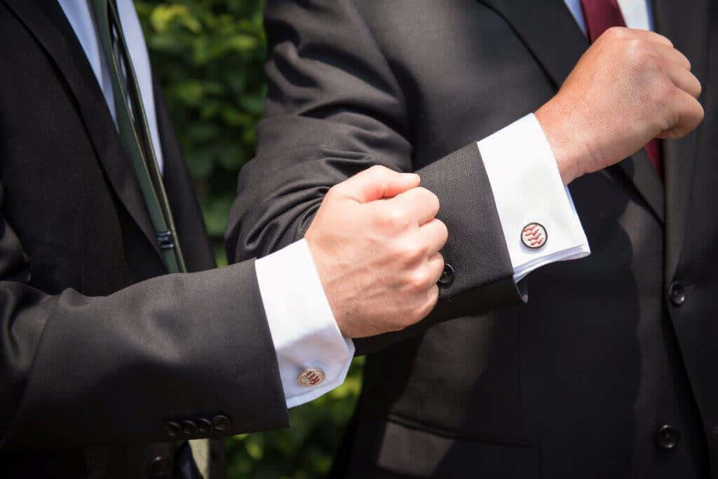 All In Faith Baseball Seam Cufflinks handmade by The Baseball Seams Company and worn with a black suit