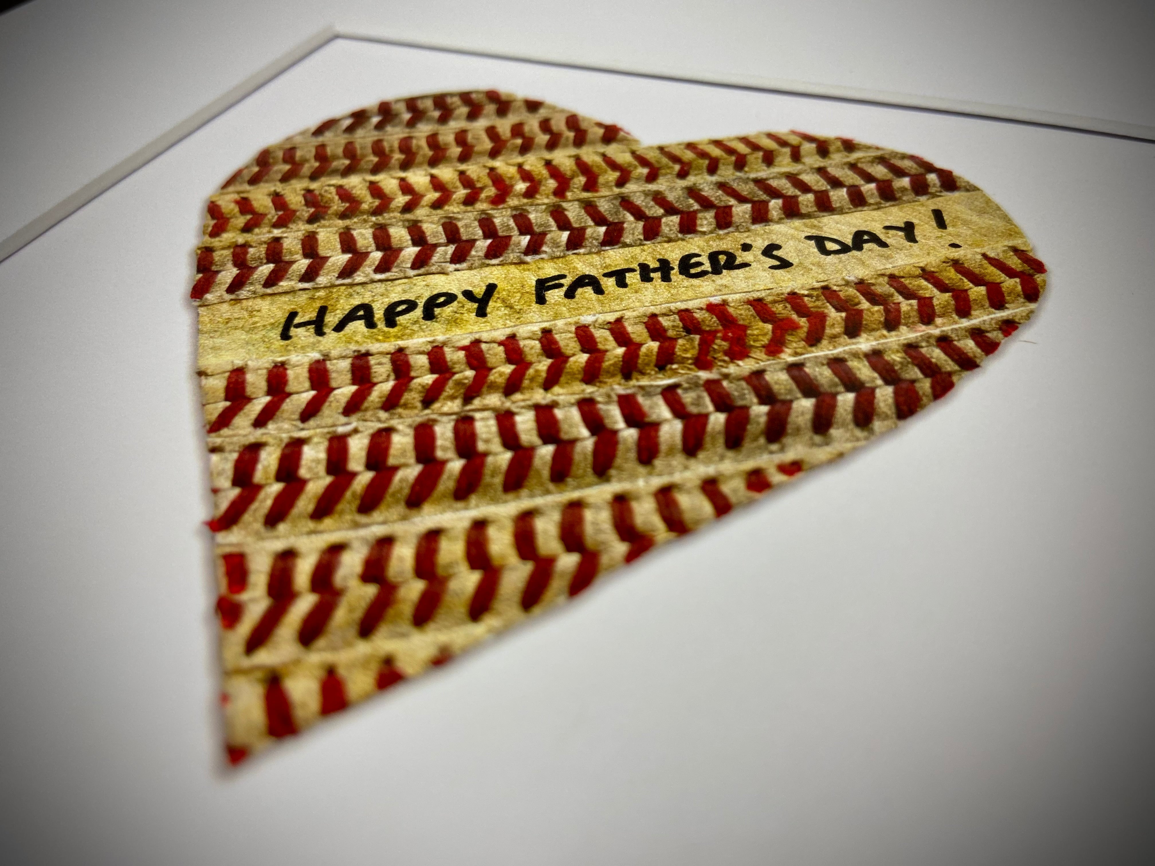 Customizable Baseball Heart Print in 10x10 White Matting featuring a heart made of baseball material with a Father's Day message.