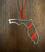 Florida Steel Baseball Christmas Ornament with red stitching, laser cut from steel, hanging with ribbon.