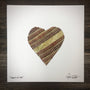Customizable Baseball Heart Print in 10x10 White Matting featuring a heart made of baseball seams