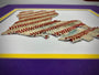 Custom State Artwork - Louisiana made from used baseballs, showcasing intricate design with baseball stitches in purple/gold matting.
