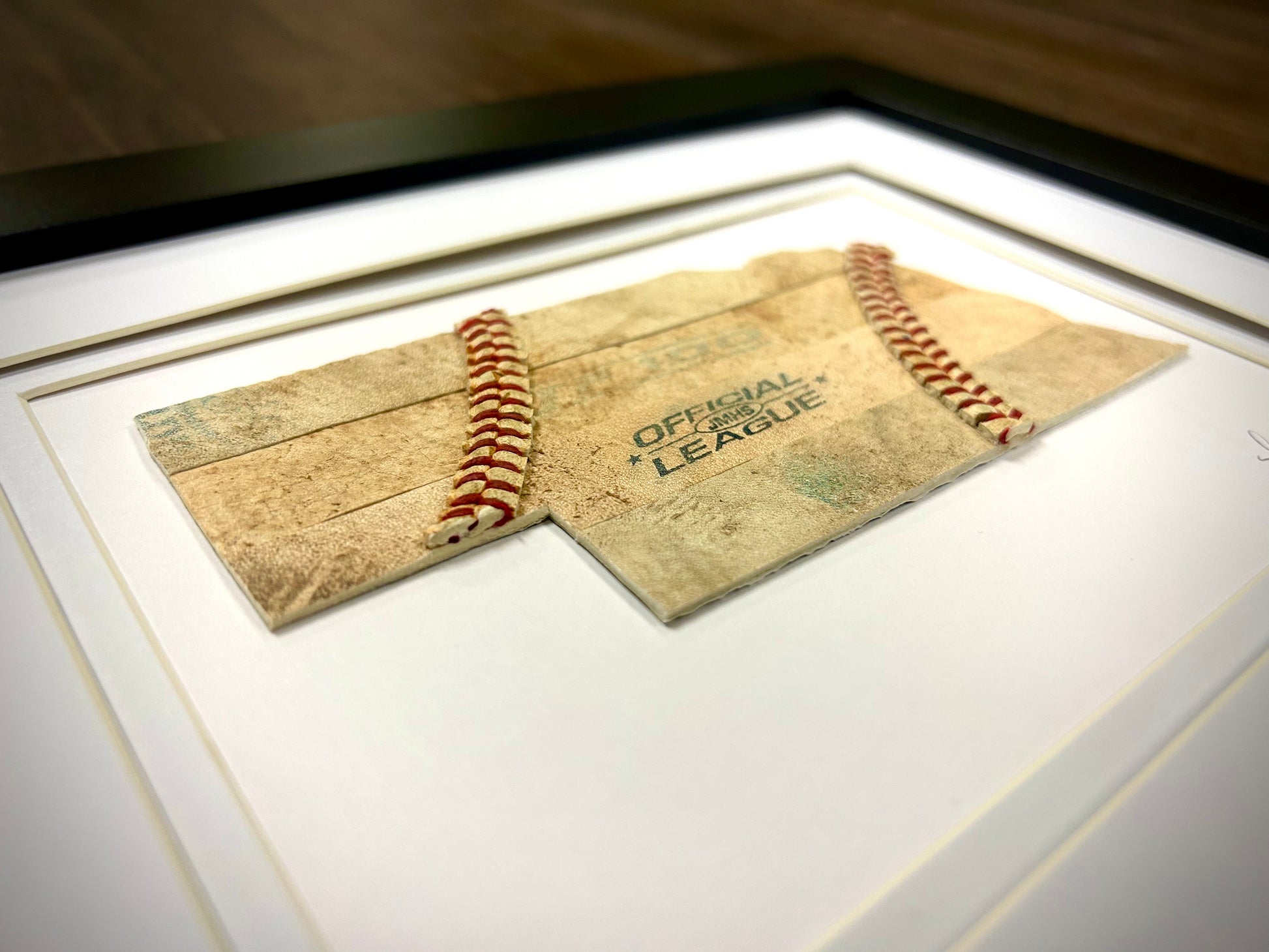 Nebraska Baseball Artwork - Made from Reclaimed Baseballs framed piece featuring a creative baseball design.
