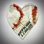 Heart-shaped design made from worn sports equipment, featuring the words 'OFFICIAL LEAGUE' and colorful detailing.