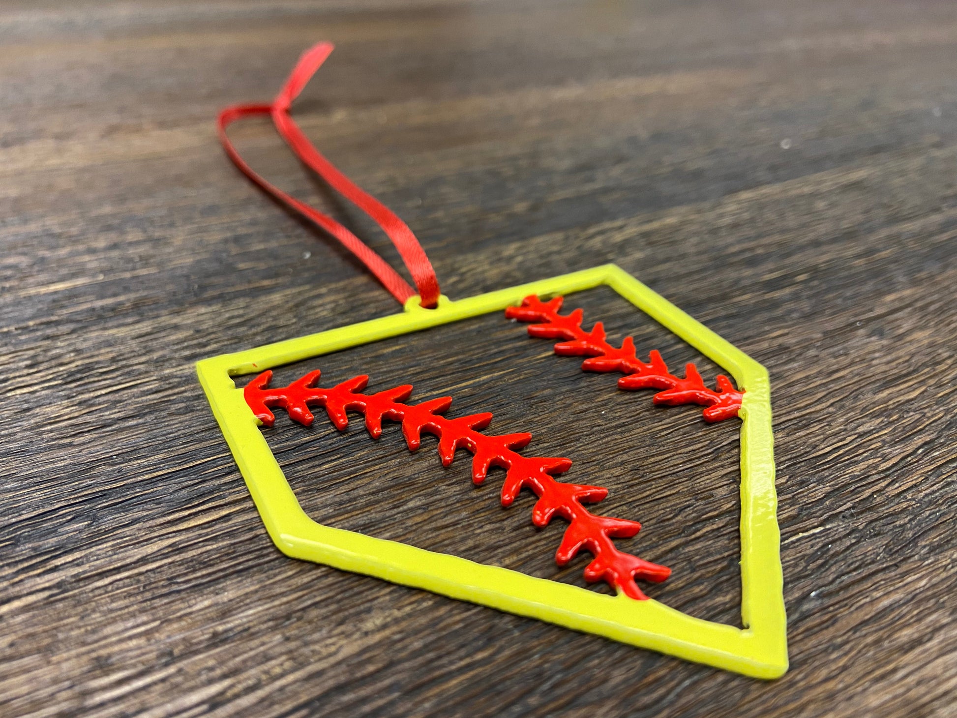 "STEEL HOME" Softball Christmas Ornament featuring a colorful baseball design with red stitches.