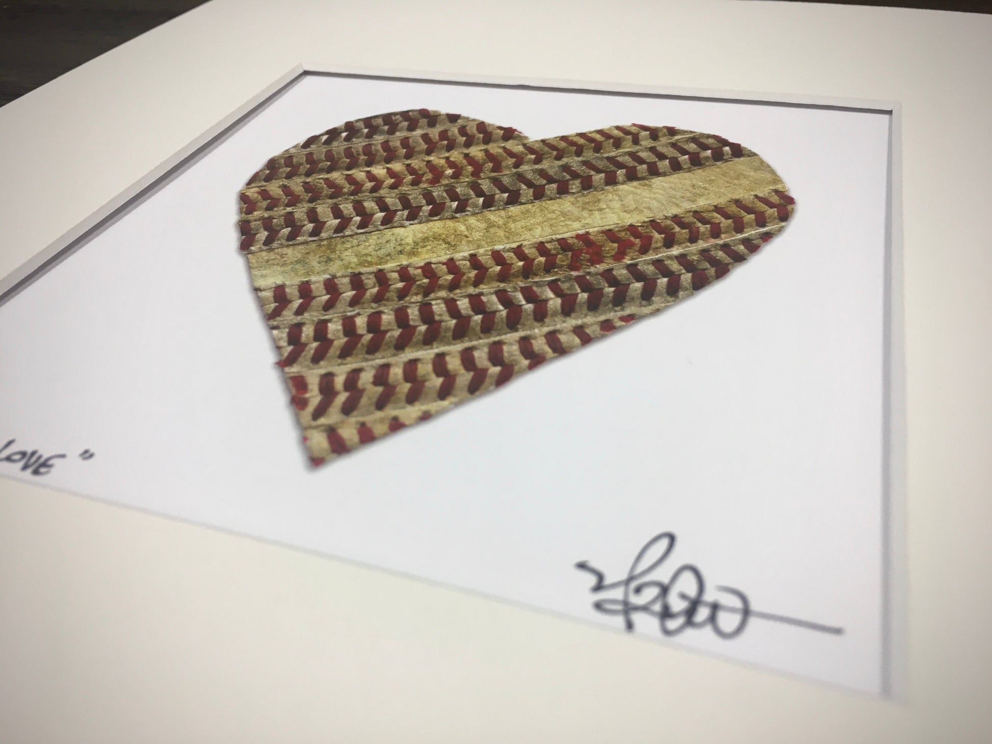 Customizable Baseball Heart Print in 10x10 White Matting featuring handmade heart design with baseball stitching.
