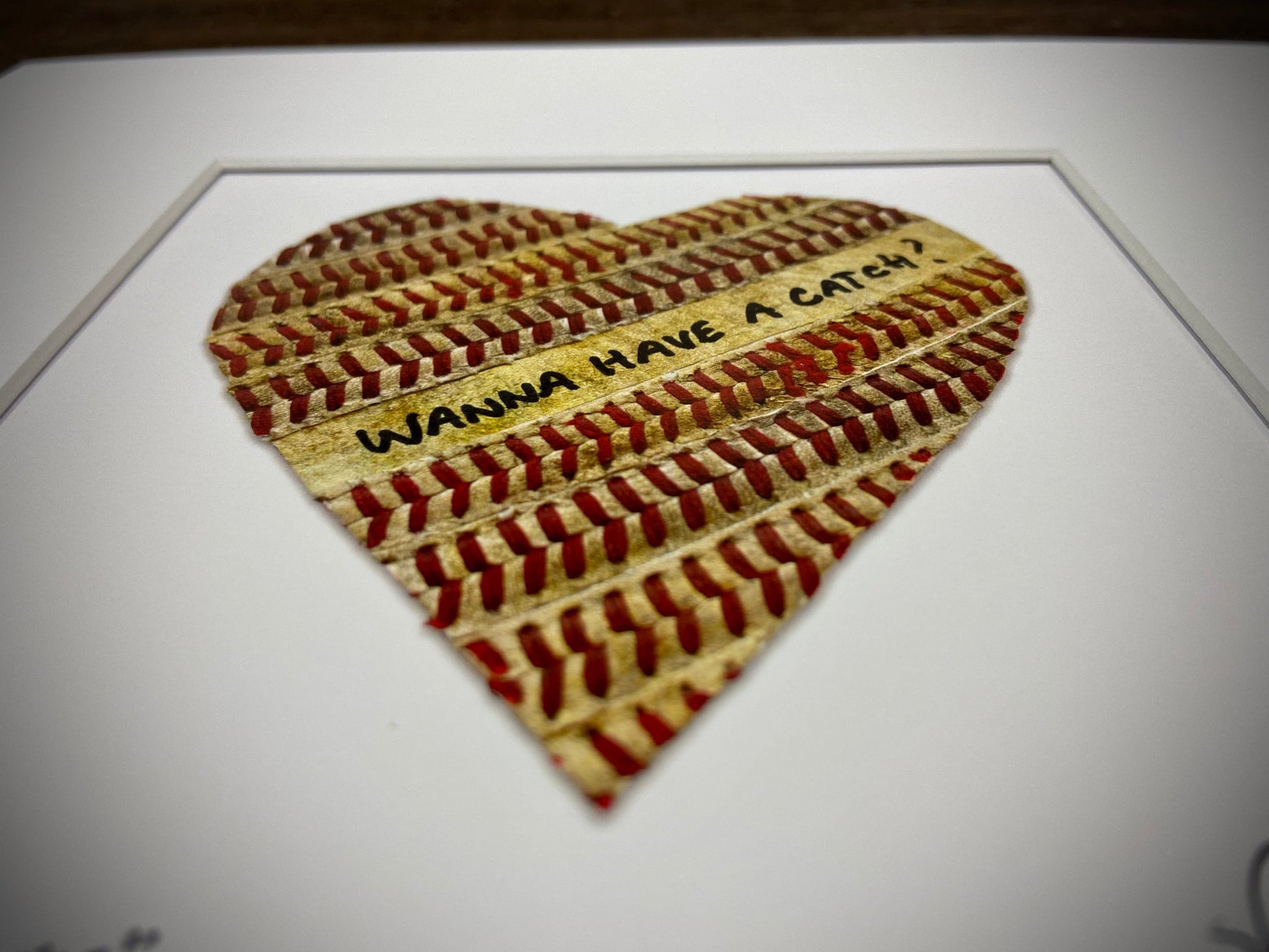 Customizable Baseball Heart Print in 10x10 White Matting featuring a heart made of baseball stitching with an inscription.