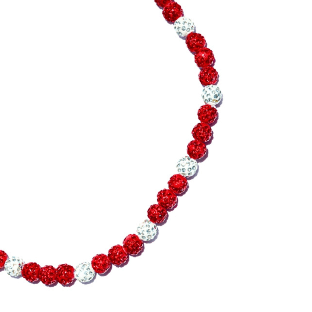 Necklace with red and white beads on a white background