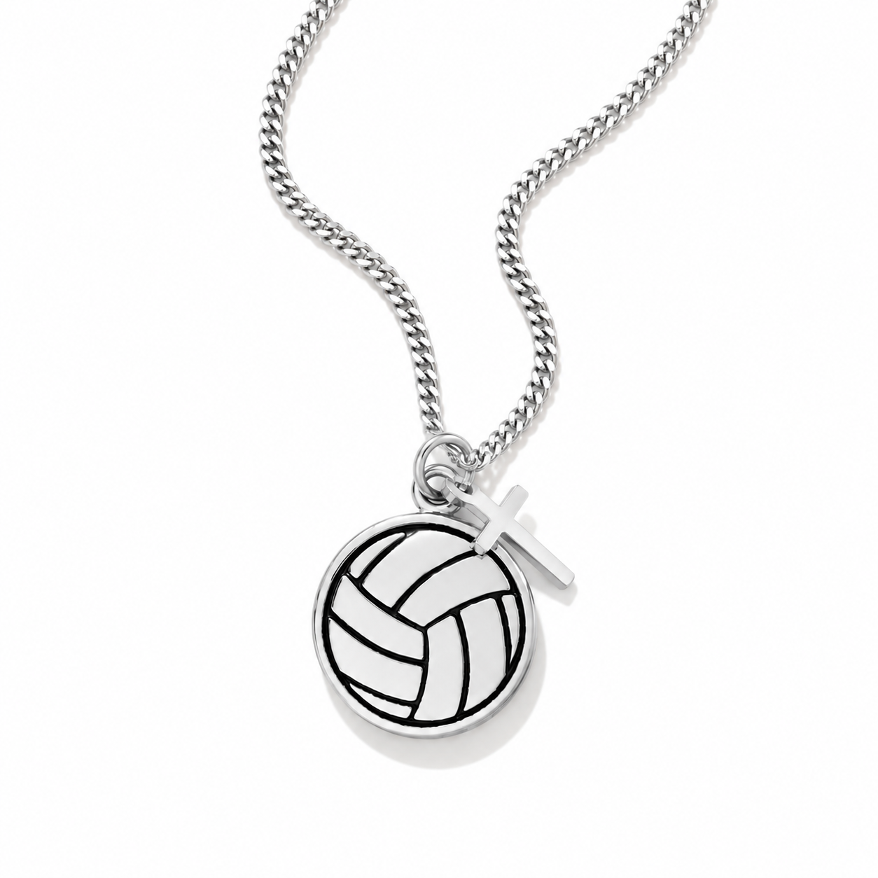 A silver chain necklace featuring a circular pendant with an engraved volleyball pattern and a small silver cross charm, shown on a clean white background.